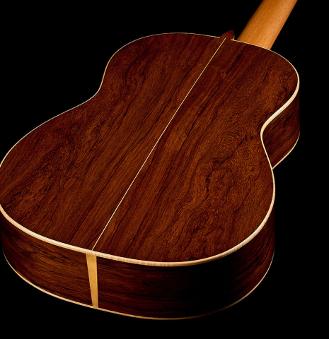 The back and sides of a 2025 Pepe Romero classical guitar made of cedar and African rosewood