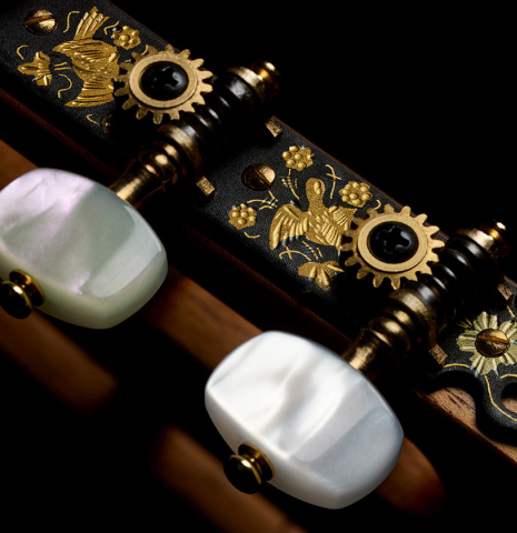 The tuning machines of a 2025 Pepe Romero classical guitar made of cedar and African rosewood