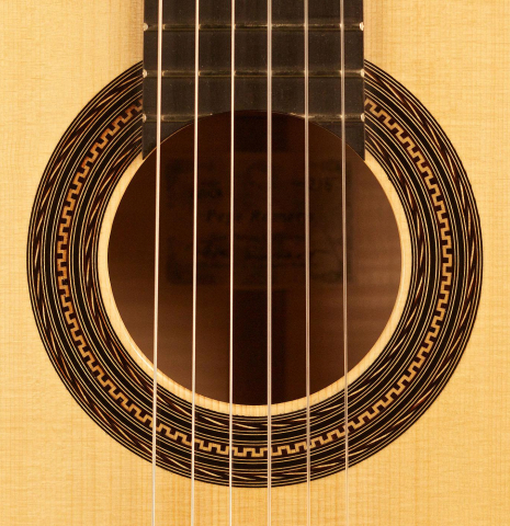 The rosette of a 2013 Pepe Romero classical guitar made of spruce and maple