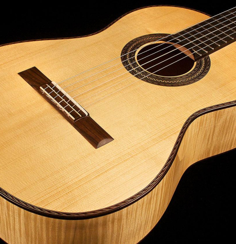 The soundboard and sides of a 2013 Pepe Romero classical guitar made of spruce and maple