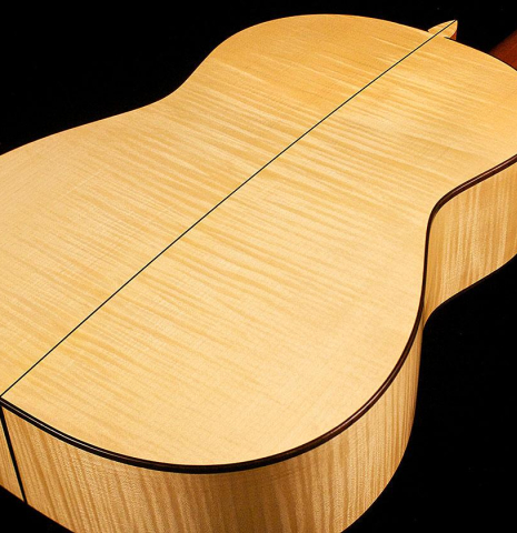 The back and sides of a 2013 Pepe Romero classical guitar made of spruce and maple
