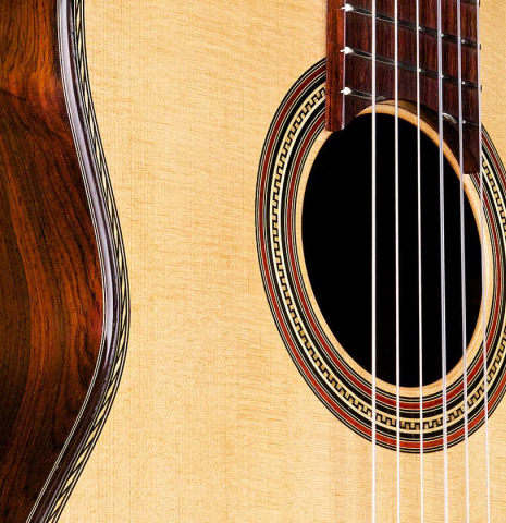 The soundboard and side of a 2017 Pepe Romero "Centenario" classical guitar made of spruce and CSA rosewood
