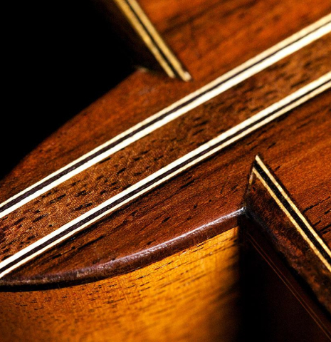 The heel and back of a 2017 Pepe Romero "Centenario" classical guitar made of spruce and CSA rosewood