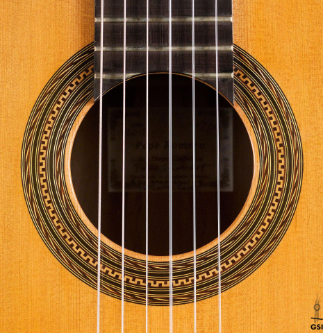The rosette of a 2012 Pepe Romero classical guitar (ex Vicente Coves) made with cedar and CSA rosewood.