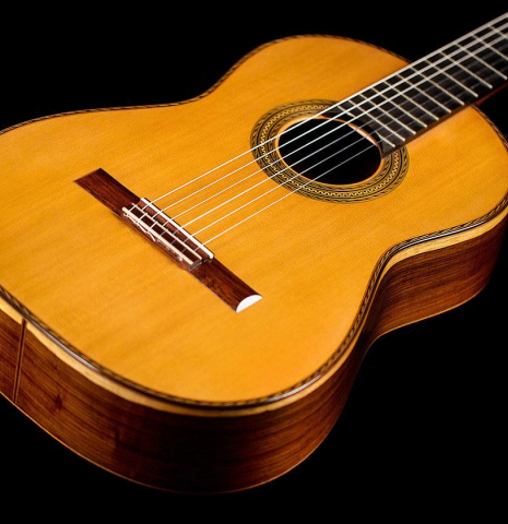 The soundboard and sides of a 2012 Pepe Romero classical guitar (ex Vicente Coves) made with cedar and CSA rosewood.