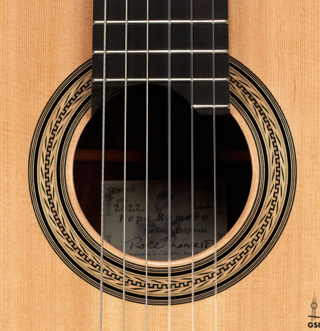 The rosette of a 2022 Pepe Romero classical guitar made of spruce and CSA rosewood.
