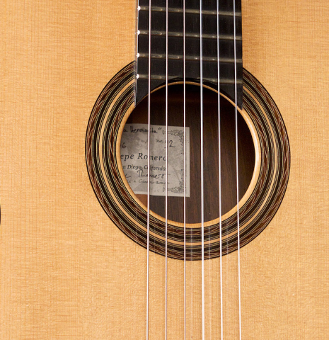 The soundboard of a 2006 Pepe Romero classical guitar made of spruce and CSA rosewood