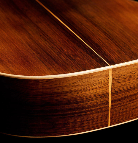 The back and sides of a 2006 Pepe Romero classical guitar made of spruce and CSA rosewood