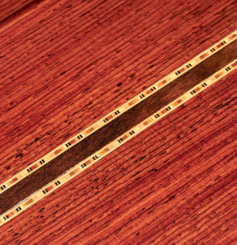 A close-up of the back of a 1982 Jose Romanillos "La Velez" classical guitar made of spruce and CSA rosewood