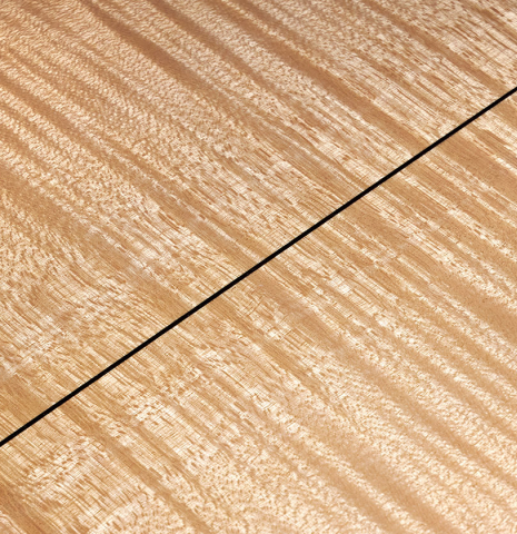 The back center seam of a 2007 Pepe Romero classical guitar made of cedar and maple