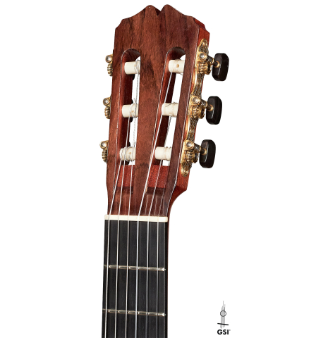 The headstock of a 2007 Pepe Romero classical guitar made of cedar and maple