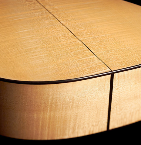 The back and sides at the foot of a 2007 Pepe Romero classical guitar made of cedar and maple