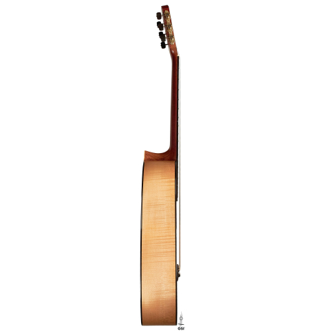 The side of a 2007 Pepe Romero classical guitar made of cedar and maple