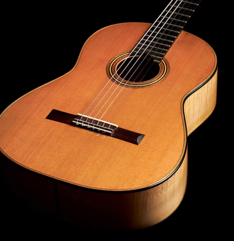 The top and sides of a 2007 Pepe Romero classical guitar made of cedar and maple