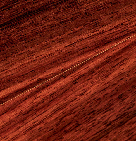 The fine and thin back purflings of a 2017 Jose L. Romanillos &amp; Son "La Campanula Azul" classical guitar made with spruce and Indian rosewood.