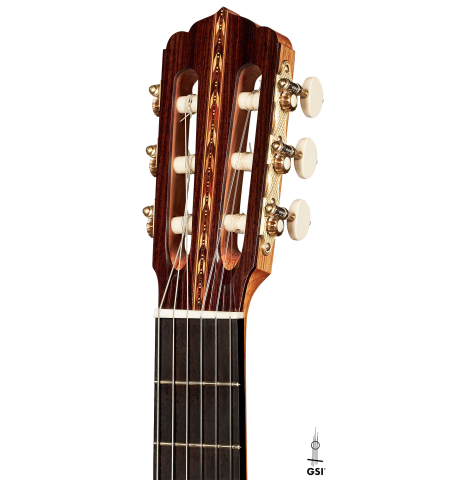 The headstock of a 2017 Jose L. Romanillos &amp; Son "La Campanula Azul" classical guitar made with spruce and Indian rosewood on a white background.