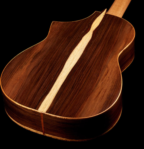The back and sides of a 2024 Pepe Romero "cutaway" classical guitar made of spruce and CSA rosewood