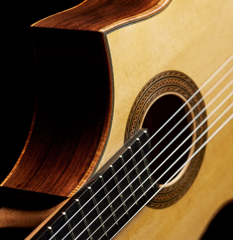 The cutaway feature of a 2024 Pepe Romero "cutaway" classical guitar made of spruce and CSA rosewood