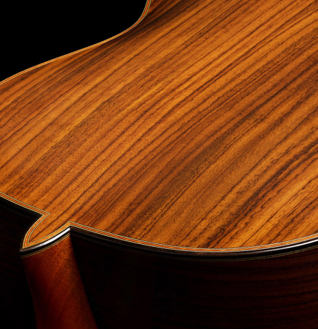 The heel, binding and purflings of a 2023 Jean Rompre classical guitar made of cedar and Indian rosewood