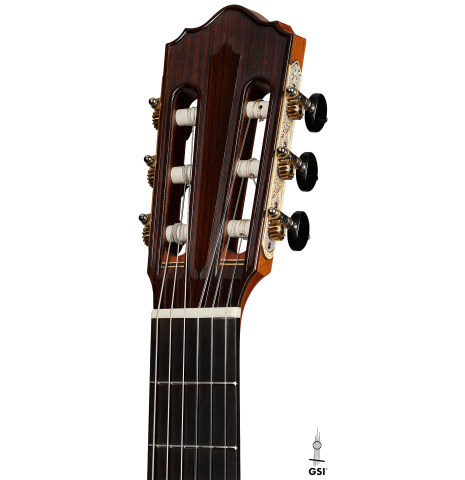 The headstock of a 2023 Jean Rompre classical guitar made of cedar and Indian rosewood