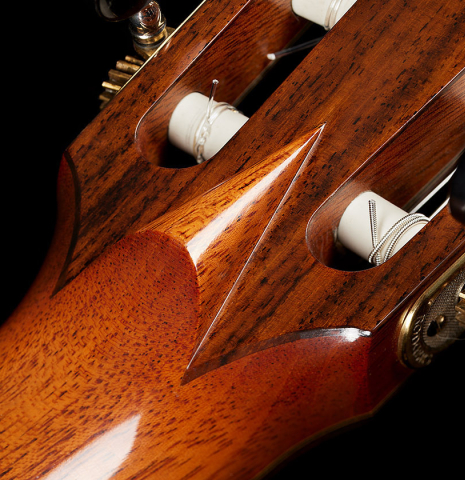 The headstock "v-joint" of a 2023 Jean Rompre classical guitar made of cedar and Indian rosewood