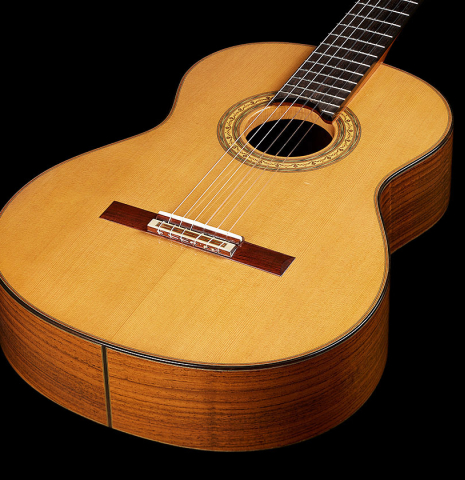 The soundboard of a 2023 Jean Rompre classical guitar made of cedar and Indian rosewood