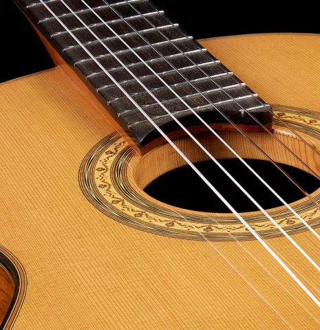 The cedar top and tornavoz of a 2023 Jean Rompre classical guitar made of cedar and Indian rosewood