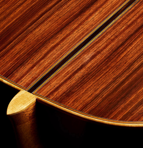 The heel, back binding and purfling of a 1981 Jose Romanillos "La Toronto" classical guitar made of spruce and Indian rosewood