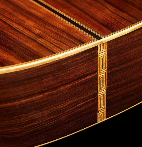 The back and sides at the foot of a 1981 Jose Romanillos "La Toronto" classical guitar made of spruce and Indian rosewood