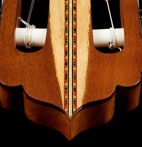 The inlaid headstock veneer of a 1981 Jose Romanillos "La Toronto" classical guitar made of spruce and Indian rosewood
