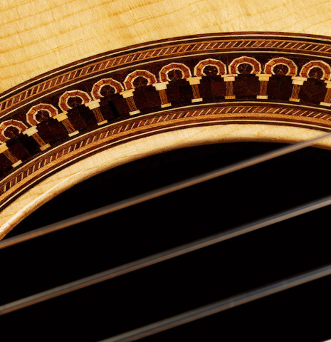 Closeup detail of the rosette of a 1981 Jose Romanillos "La Toronto" classical guitar made of spruce and Indian rosewood