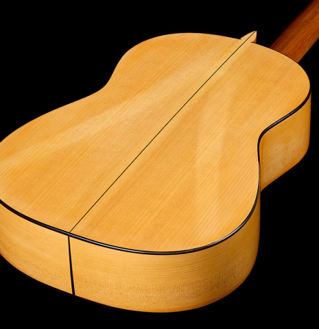 The back and sides at the foot of a 2006 Pepe Romero classical guitar made of spruce and cypress