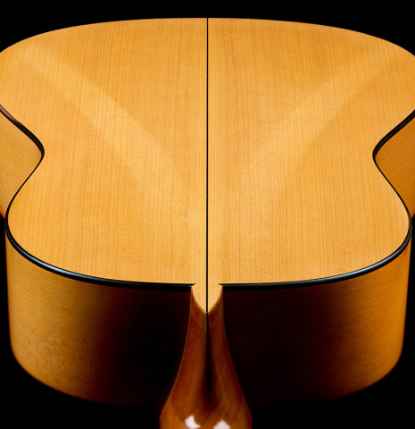 The back and sides at the heel of a 2006 Pepe Romero classical guitar made of spruce and cypress