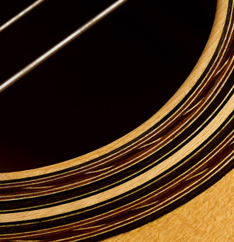 Closeup detail of the rosette of a 2006 Pepe Romero classical guitar made of spruce and cypress