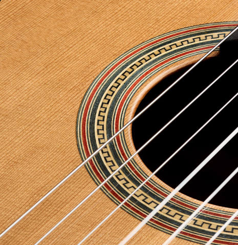 Closeup detail of the rosette of a 2023 Guitarras Romero "Espana" classical guitar made of cedar and Indian rosewood