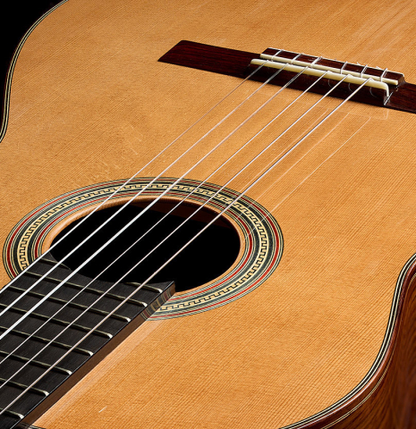 The soundboard of a 2023 Guitarras Romero "Espana" classical guitar made of cedar and Indian rosewood