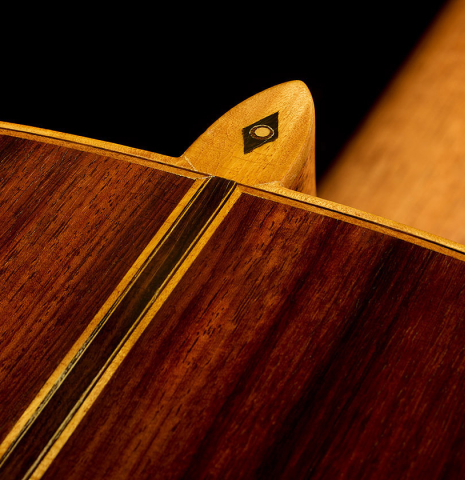 The heel, back binding and purfling of a 1981 Jose Romanillos "La España" classical guitar made of spruce and Indian rosewood