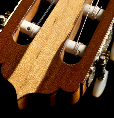 The head veneer and tuning machines of a 1981 Jose Romanillos "La España" classical guitar made of spruce and Indian rosewood
