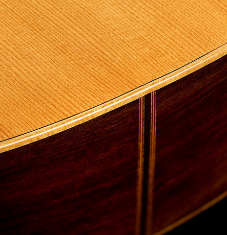 The soundboard and sides at the foot of a 1981 Jose Romanillos "La España" classical guitar made of spruce and Indian rosewood