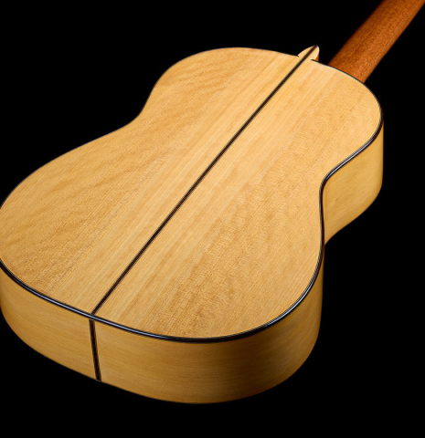 The back and sides of a 2021 Pepe Romero "640" classical guitar made of spruce and cypress
