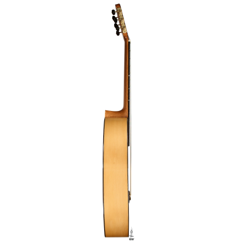 The side of a 2021 Pepe Romero "640" classical guitar made of spruce and cypress