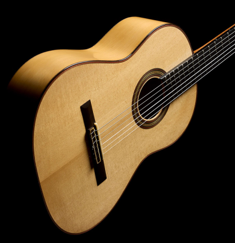 The front and side view of a 2021 Pepe Romero "640" classical guitar made of spruce and cypress