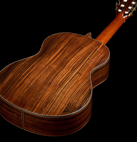 The back and sides of a 2018 Jean Rompre classical guitar made of spruce and Makassar ebony
