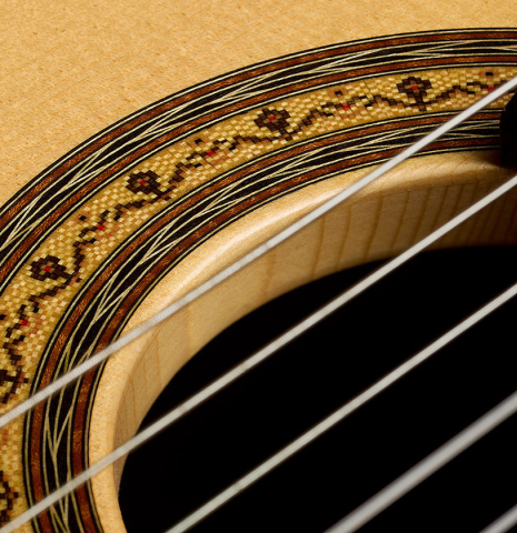 The tornavoz and rosette of a 2018 Jean Rompre classical guitar made of spruce and Makassar ebony