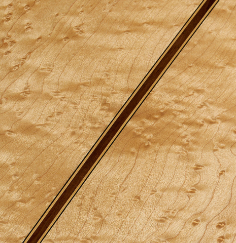 The back center seam of a 1999 Ignacio Rozas classical guitar made of spruce and maple