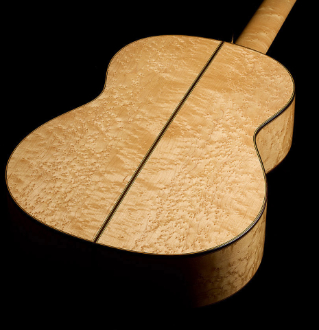 The back and sides of a 1999 Ignacio Rozas classical guitar made of spruce and maple
