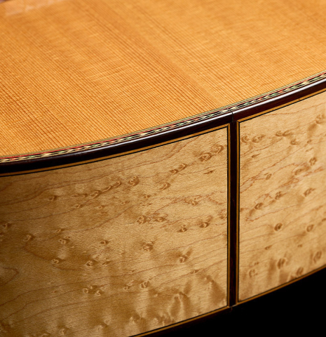 The top and sides at the foot of a 1999 Ignacio Rozas classical guitar made of spruce and maple