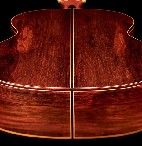 The back and sides of a 2001 Ignacio Rozas classical guitar made of cedar and CSA rosewood