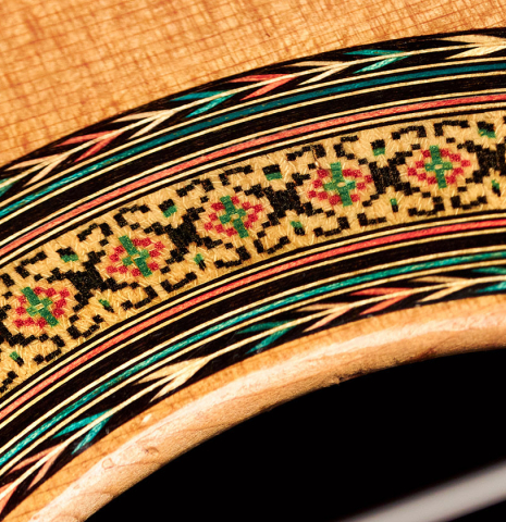 The rosette of a 2001 Ignacio Rozas classical guitar made of cedar and CSA rosewood