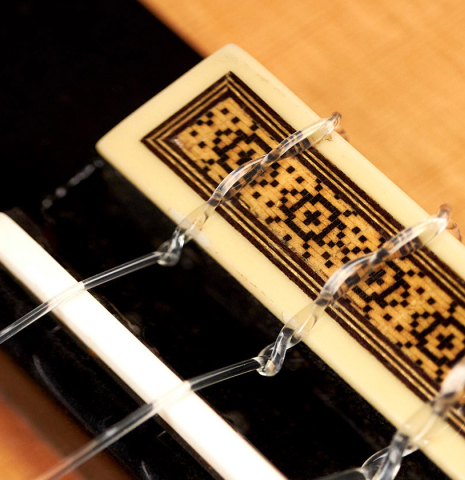 Tie-block, bridge and saddle of a 1990 Ignacio Rozas "Double Top" classical guitar made of spruce and CSA rosewood